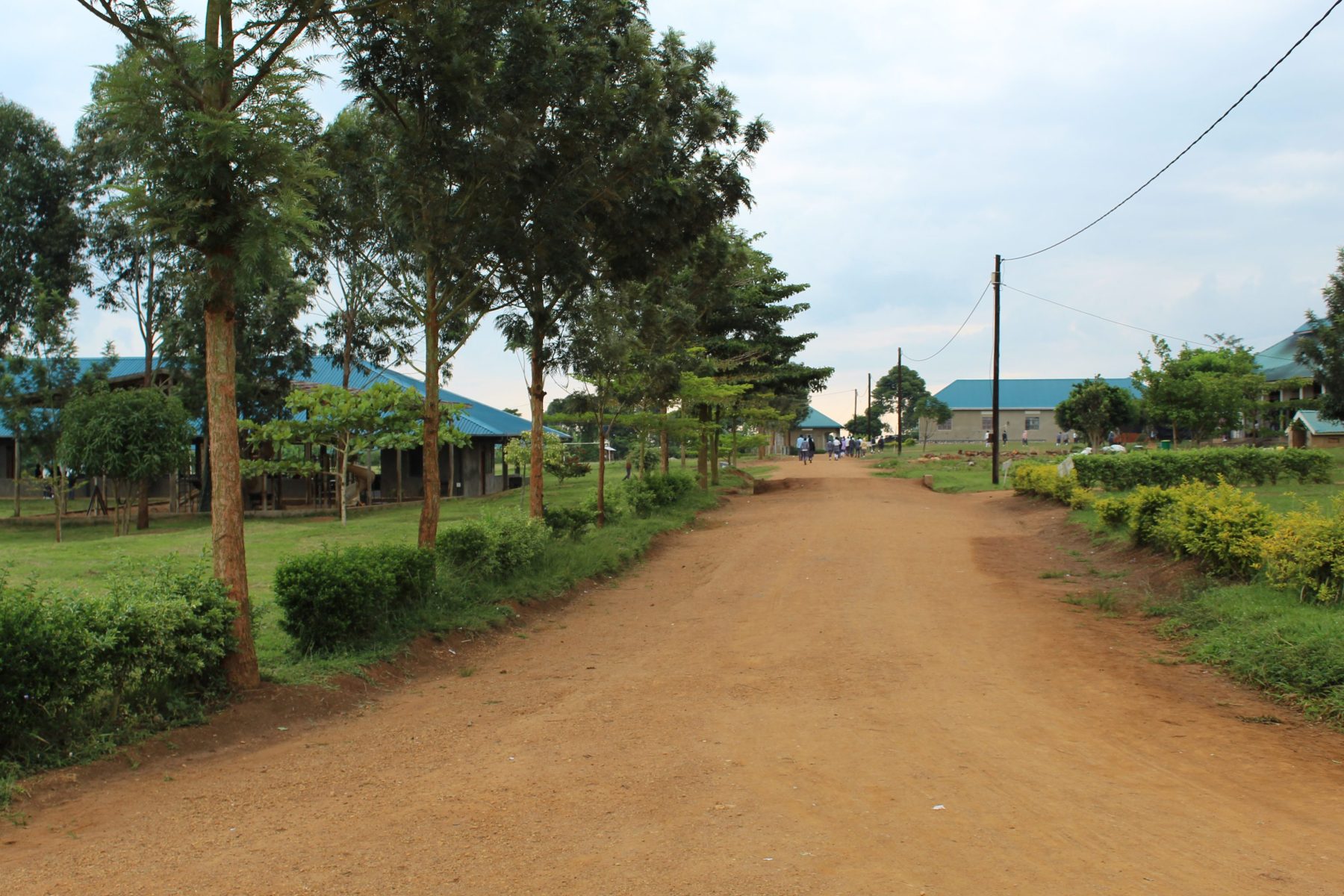 This photo shows the road leading to the three schools at Eagles Wings Children's Village: the Nursery School, Beth Pipe Primary School, and the EWCV High School.