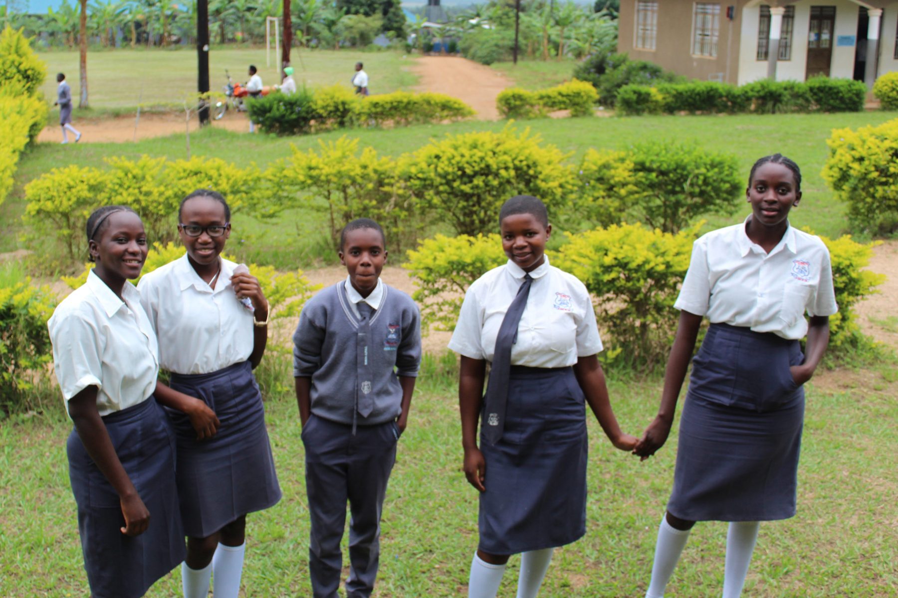 Shown in this photo are five of the 265 students who attend Eagles Wings Children's Village High School. They are looking very fine in their grey and white uniforms.