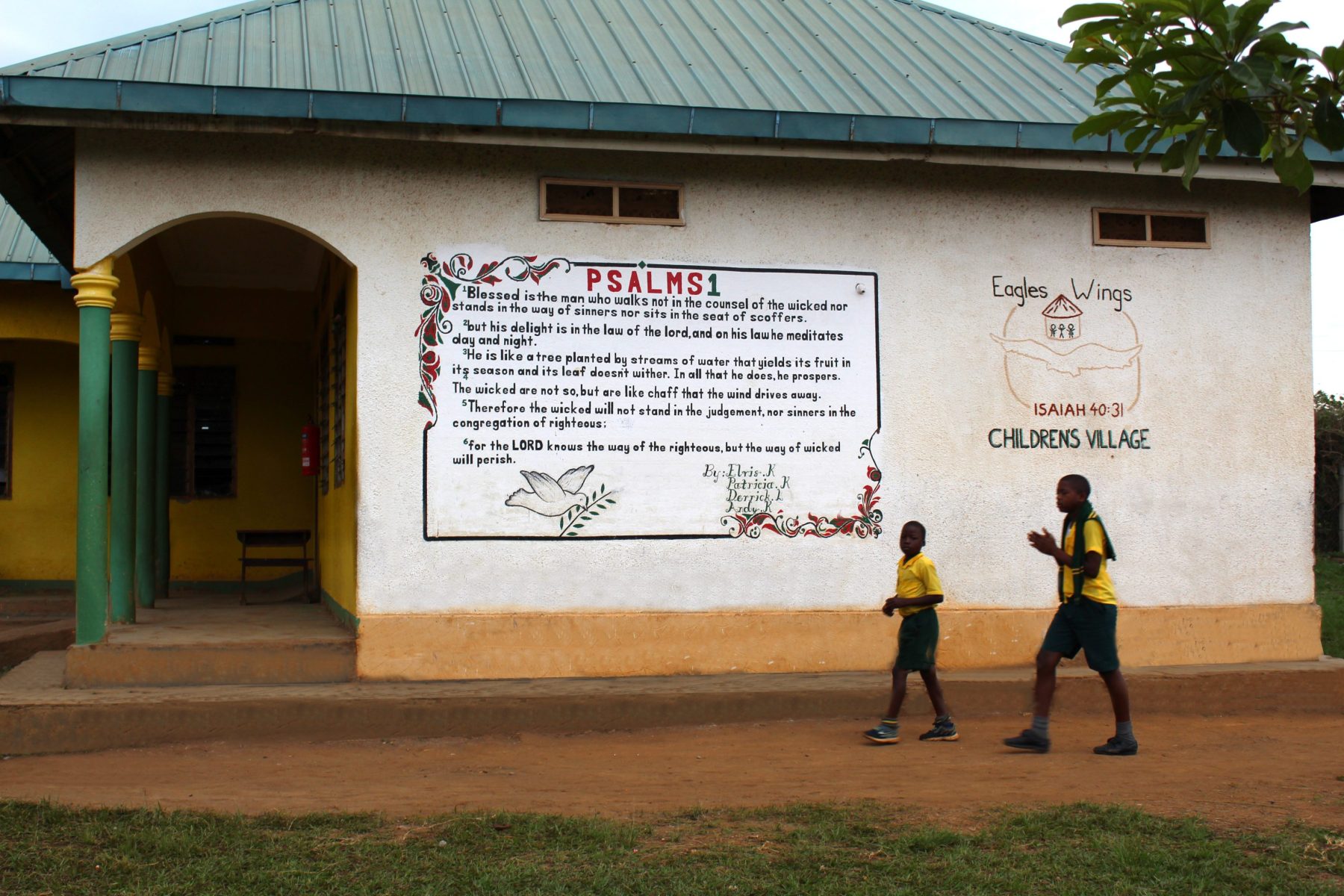 The end wall of Beth Pipe Primary School at EWCV is adorned with scripture.